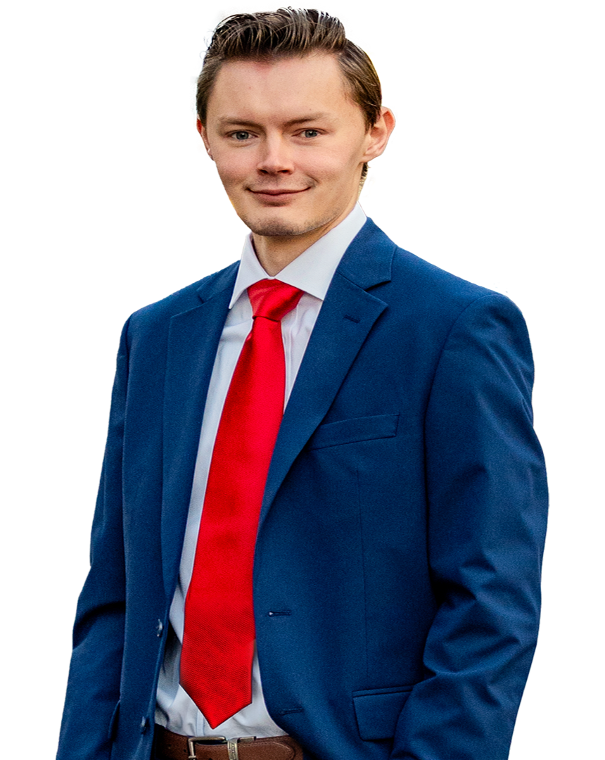 Shawn Packard wearing a blue suit and red tie